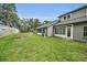 Spacious backyard with lush green grass and privacy wall, perfect for outdoor enjoyment at 184 Hunter Ct, Palm Harbor, FL 34684