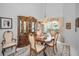 Traditional dining room with chandelier, china cabinet, and lush carpet at 184 Hunter Ct, Palm Harbor, FL 34684