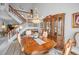 Bright dining room features chandelier, china cabinet, and staircase at 184 Hunter Ct, Palm Harbor, FL 34684