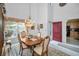 Formal dining room featuring chandelier, dining table, and bright windows at 184 Hunter Ct, Palm Harbor, FL 34684
