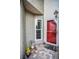 Exterior entrance featuring red door, patterned brick tile and window at 184 Hunter Ct, Palm Harbor, FL 34684
