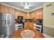 Eat-in kitchen featuring stainless steel appliances and granite countertops at 184 Hunter Ct, Palm Harbor, FL 34684