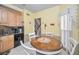 Eat-in kitchen featuring a window with blinds and a view of the staircase at 184 Hunter Ct, Palm Harbor, FL 34684