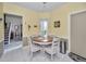 Eat-in kitchen featuring a window and a view of the entryway at 184 Hunter Ct, Palm Harbor, FL 34684