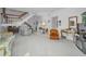 Bright living room featuring staircase, fireplace, and comfortable seating at 184 Hunter Ct, Palm Harbor, FL 34684