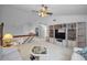 Bright living room featuring built-in bookshelves and a view of the upstairs loft at 184 Hunter Ct, Palm Harbor, FL 34684