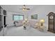 Neutral living room with a vaulted ceiling, decor, and lots of natural light at 184 Hunter Ct, Palm Harbor, FL 34684