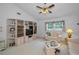 Bright living room with neutral color palette and built-in bookshelves and cabinets at 184 Hunter Ct, Palm Harbor, FL 34684