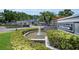 Community entrance with a fountain and sign reading 'Steeplechase Town Homes' at 184 Hunter Ct, Palm Harbor, FL 34684
