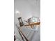 Bright staircase leading to the lower level, with natural light pouring in from a nearby window at 184 Hunter Ct, Palm Harbor, FL 34684