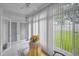 Bright sunroom with large windows offering natural light and a view of the green outdoors at 184 Hunter Ct, Palm Harbor, FL 34684