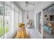 Cozy sunroom filled with natural light, featuring a comfortable lounge chair and views of the outdoors at 184 Hunter Ct, Palm Harbor, FL 34684