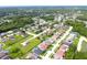 Expansive aerial view of a well-developed residential area surrounded by lush greenery and sparkling bodies of water at 1842 Ridgelake Ct, Wesley Chapel, FL 33543