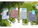 Overhead shot of several private residences that have screened-in pools and manicured yards, revealing a suburban community at 1842 Ridgelake Ct, Wesley Chapel, FL 33543
