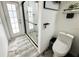 Bathroom showcasing the glass shower, toilet, and fixtures with lots of natural light streaming through the glass exterior door at 1842 Ridgelake Ct, Wesley Chapel, FL 33543