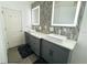 The bright bathroom boasts dual sinks, vanity, white countertop, and modern fixtures at 1842 Ridgelake Ct, Wesley Chapel, FL 33543