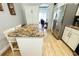 Kitchen featuring a granite island with seating and stainless steel appliances at 1842 Ridgelake Ct, Wesley Chapel, FL 33543