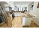 Bright kitchen featuring an island with seating, stainless steel appliances, and light countertops at 1842 Ridgelake Ct, Wesley Chapel, FL 33543