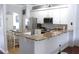 Bright kitchen featuring white cabinetry, granite countertops and stainless steel appliances at 1842 Ridgelake Ct, Wesley Chapel, FL 33543