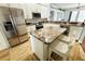 Well-equipped kitchen with a center island, granite countertops, and stainless steel appliances at 1842 Ridgelake Ct, Wesley Chapel, FL 33543