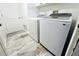 Bright laundry room featuring modern Samsung washer and dryer set at 1842 Ridgelake Ct, Wesley Chapel, FL 33543