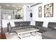 Open floor plan showcasing the living room with views into the kitchen and stylish decor at 1842 Ridgelake Ct, Wesley Chapel, FL 33543