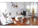 Spacious living room with hardwood floors, large windows, and contemporary decor at 1842 Ridgelake Ct, Wesley Chapel, FL 33543