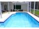 Wonderful screened-in pool area with an outdoor seating area, perfect for entertaining at 1842 Ridgelake Ct, Wesley Chapel, FL 33543