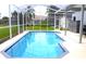 Well-maintained screened-in pool area with plenty of space for relaxation and recreation at 1842 Ridgelake Ct, Wesley Chapel, FL 33543