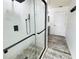New and modern bathroom showcasing the sleek shower, fixtures, and marble flooring with lots of natural light streaming at 1842 Ridgelake Ct, Wesley Chapel, FL 33543