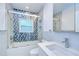 Bathroom featuring decorative tile, shower with glass door, modern fixtures, and vanity at 2051 Indigo Dr, Clearwater, FL 33763