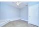 Minimalist bedroom featuring refinished flooring, fresh paint, and ample closet space at 2051 Indigo Dr, Clearwater, FL 33763