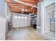Spacious garage with storage racks, laundry area, and access to a half-bathroom at 2051 Indigo Dr, Clearwater, FL 33763
