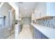 Bright kitchen with stainless steel appliances, white cabinets, and a stylish tile backsplash at 2051 Indigo Dr, Clearwater, FL 33763