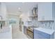 Bright kitchen with stainless steel appliances, modern countertops, and custom backsplash at 2051 Indigo Dr, Clearwater, FL 33763
