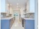 Stylish modern kitchen featuring sleek cabinetry, countertops, and stainless steel appliances at 2051 Indigo Dr, Clearwater, FL 33763