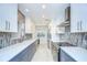 Bright kitchen featuring sleek countertops, modern cabinets, and stainless steel appliances at 2051 Indigo Dr, Clearwater, FL 33763
