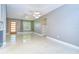 Bright and airy living room featuring modern lighting, neutral paint, and sleek floors at 2051 Indigo Dr, Clearwater, FL 33763