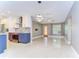 Open-concept living area with sleek floors, a modern kitchen, and a bright living room at 2051 Indigo Dr, Clearwater, FL 33763