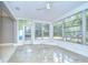 Inviting sun room with lots of windows, decorative windows, and natural light at 2051 Indigo Dr, Clearwater, FL 33763