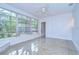 Bright sun room with large windows offering views of the surrounding landscape at 2051 Indigo Dr, Clearwater, FL 33763