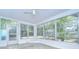 Inviting sun room with lots of windows, decorative windows, and natural light at 2051 Indigo Dr, Clearwater, FL 33763