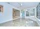 Sunroom featuring polished concrete floors, many windows, and a bright, open space at 2051 Indigo Dr, Clearwater, FL 33763