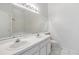 Bright bathroom featuring a double vanity, large mirror, and tub/shower combo at 2248 Lake Woodberry Cir, Brandon, FL 33510