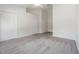 Spacious bedroom with multiple closets, neutral carpeting, and a ceiling fan for comfort at 2248 Lake Woodberry Cir, Brandon, FL 33510