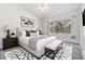 Beautiful bedroom with a large window providing natural light and stylish modern decor at 2248 Lake Woodberry Cir, Brandon, FL 33510