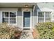 Inviting front entrance with well-manicured shrubs and windows at 2248 Lake Woodberry Cir, Brandon, FL 33510