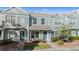 Exterior view of light blue two-story townhome with well-maintained landscaping at 2248 Lake Woodberry Cir, Brandon, FL 33510