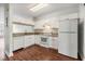 Bright kitchen featuring white cabinets, granite countertops, and modern appliances for a clean, stylish design at 2248 Lake Woodberry Cir, Brandon, FL 33510