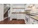 Modern kitchen with white cabinets and stainless steel appliances at 2248 Lake Woodberry Cir, Brandon, FL 33510